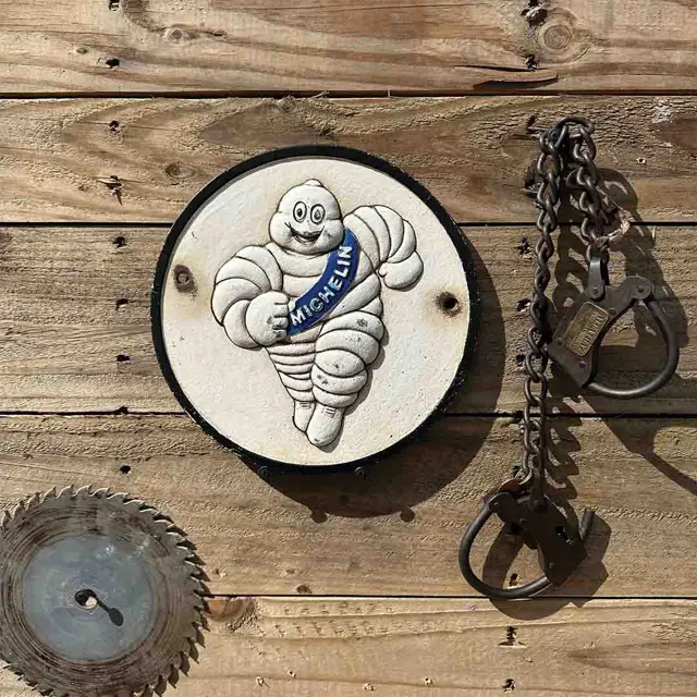 Tire Man Round Antique Finish Cast Iron Sign